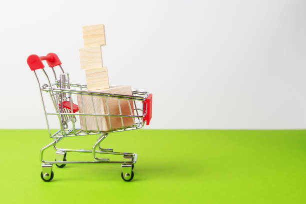 istock Shopping and bussines concept. Hand picking wooden cube. 1252505260