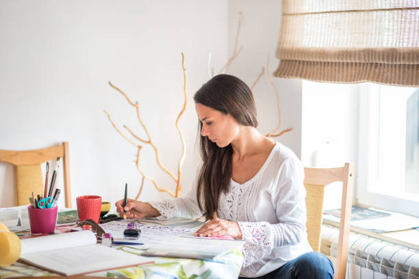 istock Gorgeous woman expressing her creativity with calligraphy 1252514220