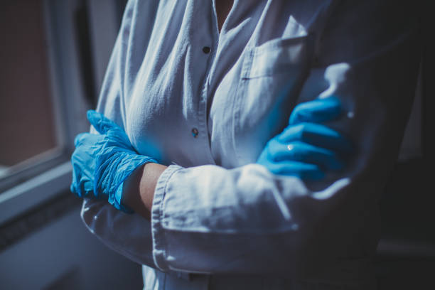 istock female doctor in protective suit 1252526904