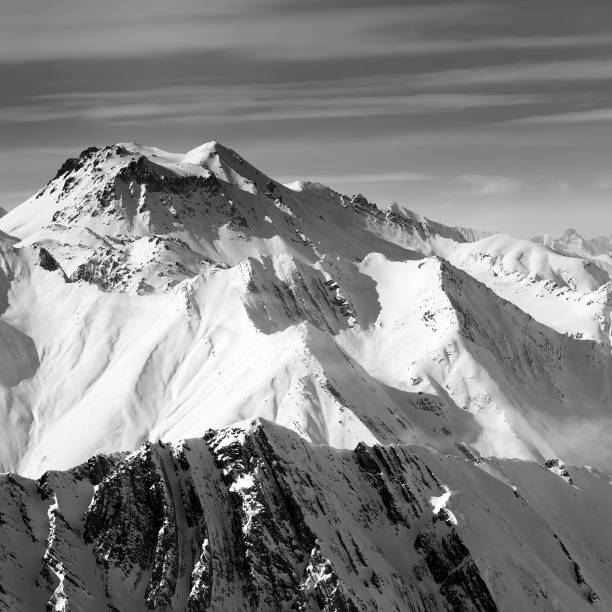 istock Black and white view on snowy high mountains in winter 1252527109