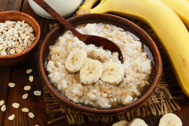Porridge with bananas and honey stock photo