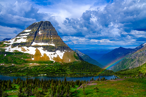 2403_A rainbow forms as sunlight hits the mountain after the storm :  Bear Hat Mountain - Glacier National Park - Montana