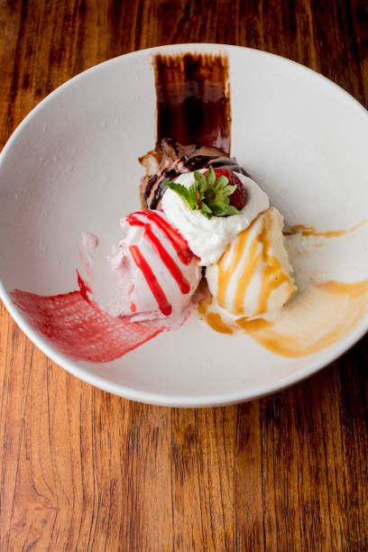 Ice cream, chocolate, vanilla and strawberry topped with whipped cream, chocolate syrup and strawberries. Classic American or French bakeries or pastry shop favorites. Cookies, whipped cream, cakes, chocolate syrup butter, eggs and and vanilla beans.