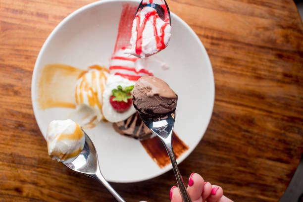 Ice cream, chocolate, vanilla and strawberry topped with whipped cream, chocolate syrup and strawberries. Classic American or French bakeries or pastry shop favorites. Cookies, whipped cream, cakes, chocolate syrup butter, eggs and and vanilla beans.
