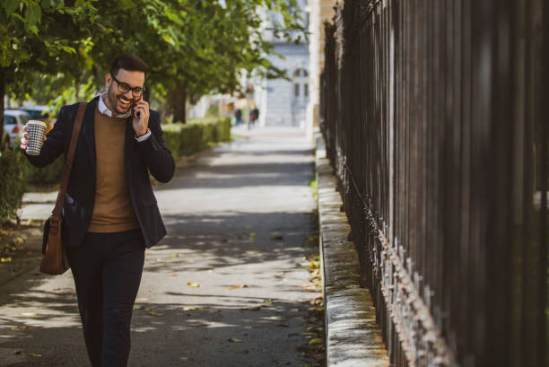 istock A handsome young hipster taking a walk, carrying a reusable to-go coffee cup in his hand. 1252540707