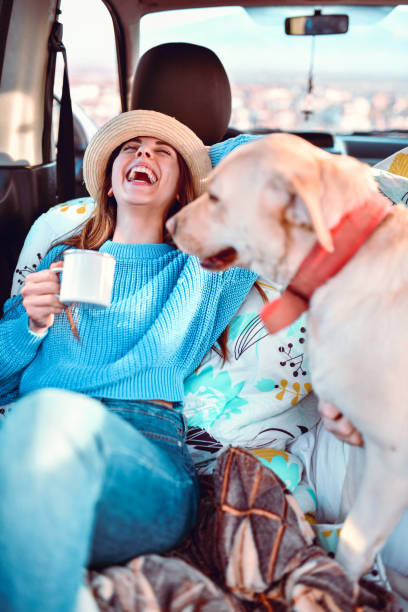 istock Female Enjoying Road Trip With Pet Dog 1252547649