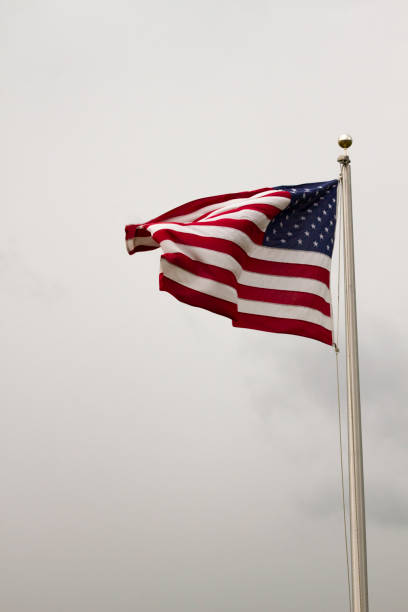 istock American Flag Flapping in the Wind 1252548312