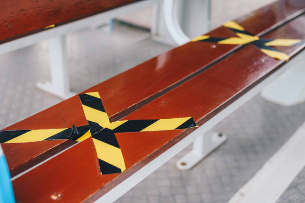 The marking on empty wooden chair without nobody sitting on it.