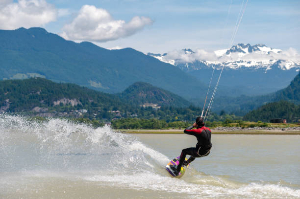 istock Man kiteboarding along the coast 1252563584