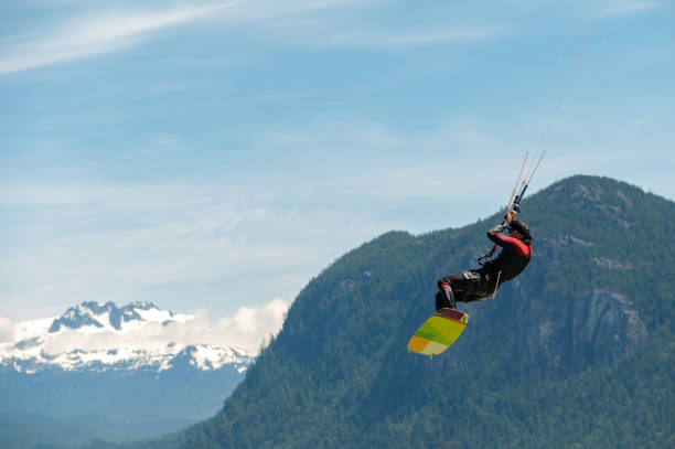 Man kiteboarding along the coast