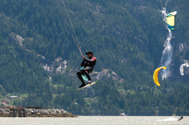 istock Man kiteboarding along the coast 1252563586