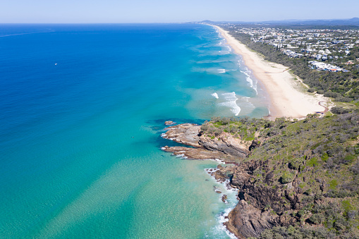 Looking down the coast from the Noosa National Park at Sunshine Beach towards Coolum Beach on a sunny day