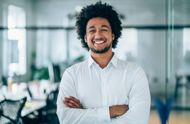 istock Smiling businessman in modern office. 1252568083