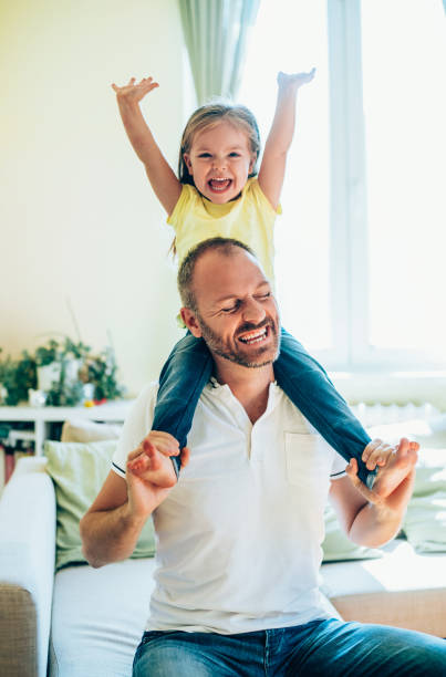 istock Father and daughter playing at home. 1252568086