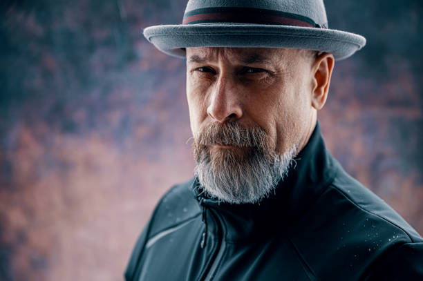istock Older man with gray beard wearing a fedora 1252571108