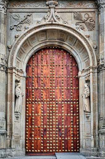 Two exterior red doors at St. Peter's Episcopal Church located in Chelsea neighborhood in New York City in daytime.