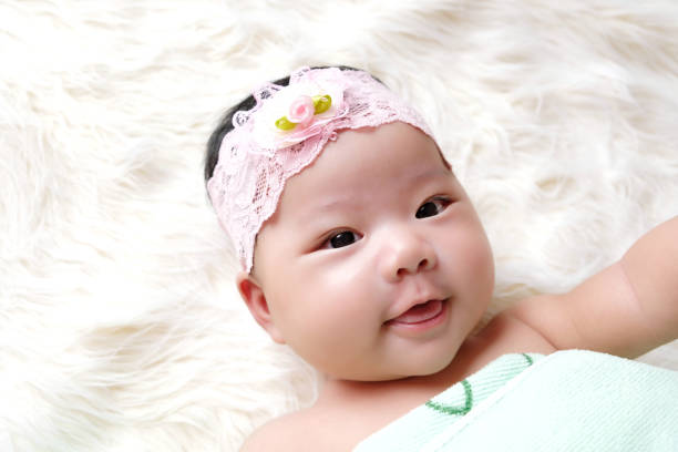 istock Cute newborn baby sleep on white fabric background. 1252580482