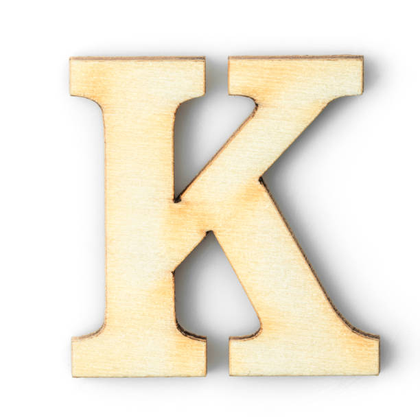 istock Wooden Alphabet letter with drop shadow K 1252581787