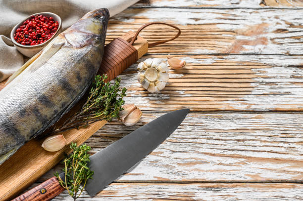 istock Fresh Zander, walleye with herbs. Raw fish. White background. Top view. Copy space 1252584534