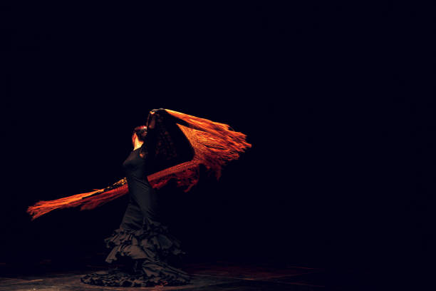 Flamenco dancer in traditional costume. Flamenco spanish dance on stage. stock photo
