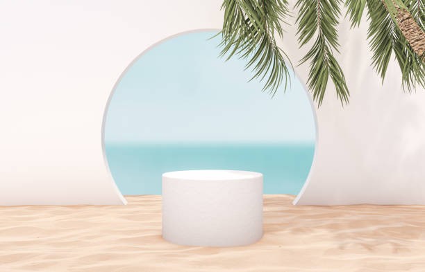 istock Natural summer beach backdrop with white cylinder box and palm tree shadow for product display. 1252589546