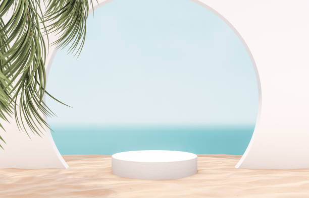 istock Natural summer beach backdrop with white cylinder box and palm tree shadow for product display. 1252589550