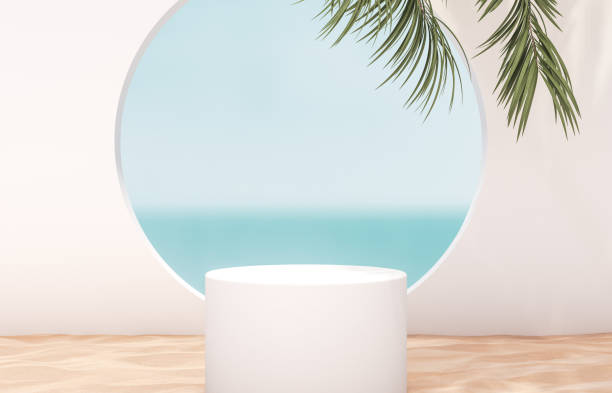 istock Natural summer beach backdrop with white cylinder box and palm tree shadow for product display. 1252589551