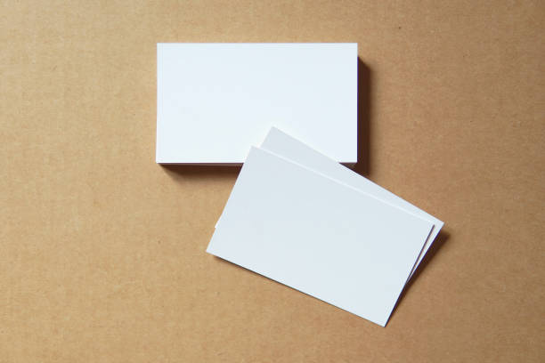 istock Business card blank on colored background. 1252593872