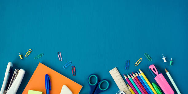 School supplies on blue background School supplies on blue background. Top view. Banner with copy space. school supplies stock pictures, royalty-free photos & images
