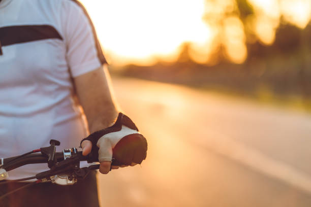 istock Cyclist holding bicycle steering wheel 1252597122