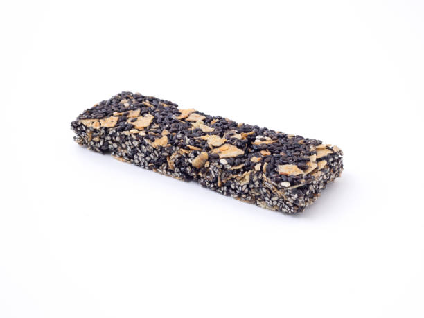 istock Black sesame cereal bar isolated on a white background, eat for weight control. 1252597642