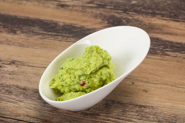 istock Avocado guacamole sauce with chili pepper 1252599406