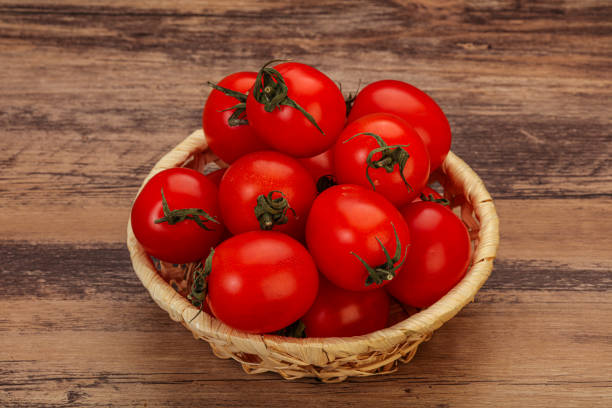 istock Ripe juicy cherry tomato in the bowl 1252599502