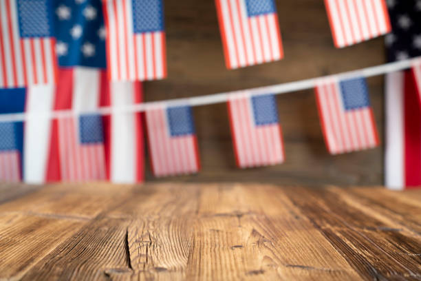 American flags on the wooden rustic table.