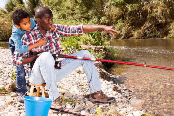 istock Man and his son fishing 1252601290