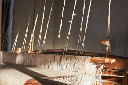 traditional Kashmir weaving workshop with the wooden shuttle on a loom in Jammu and Kashmir wool Cashmere wool