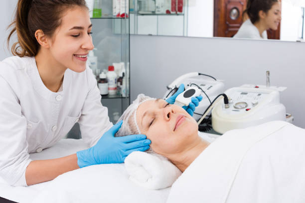 istock Mature woman having beauty procedures 1252602673