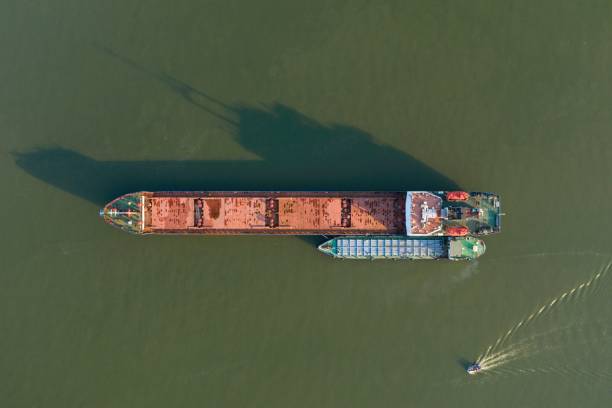 istock Commercial ship crossing the river. 1252605735