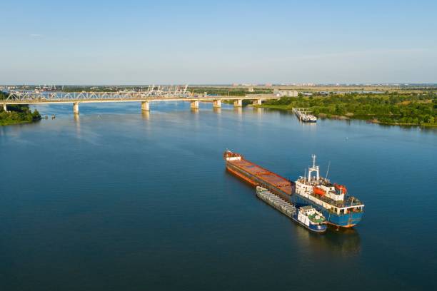 istock Commercial ship crossing the river. 1252605749