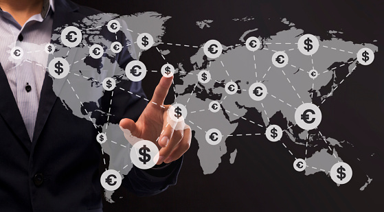 Money Transfers Worldwide. Collage Of Unrecognizable Businessman Pointing On World Map With Currency Icons Network Over Dark Background, Panorama