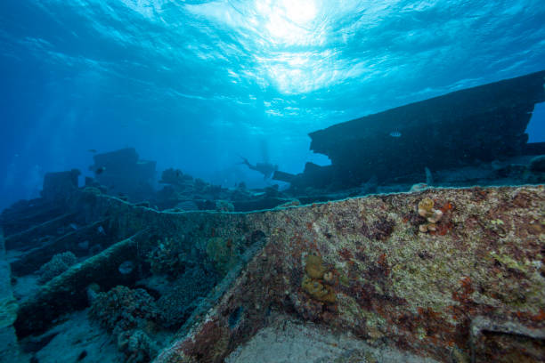 istock Blue sea and sunken ship 1252608919