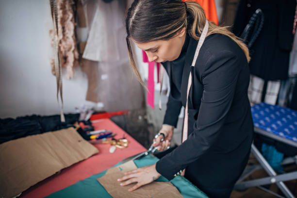 istock Female fashion designer working in her workshop 1252613470