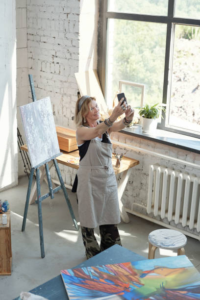 istock Taking selfie against own picture 1252614400