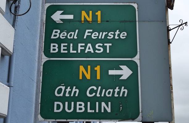 Road signage 26th June 2020, Drogheda, County Louth, Ireland. Belfast, Dublin and Drogheda Town Centre directional road signs in English (and translated directly into the Irish language) in Drogheda town centre. northern ireland photos stock pictures, royalty-free photos & images