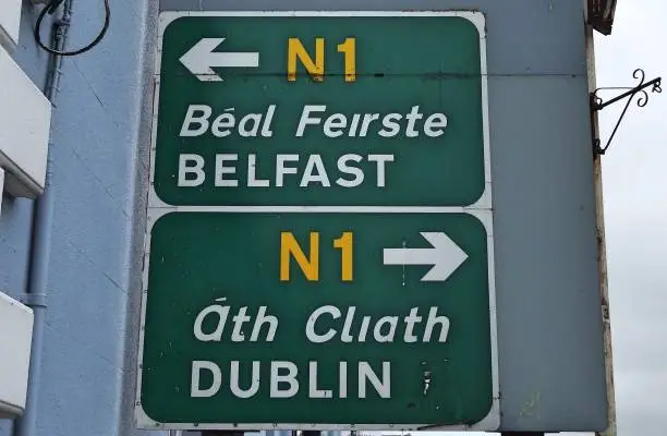 26th June 2020, Drogheda, County Louth, Ireland. Belfast, Dublin and Drogheda Town Centre directional road signs in English (and translated directly into the Irish language) in Drogheda town centre.