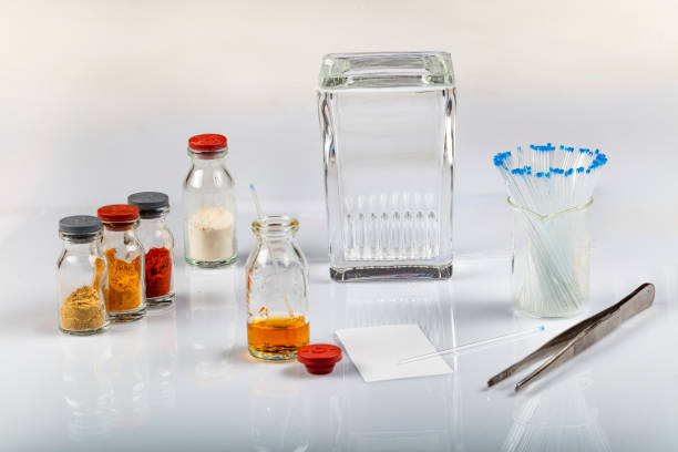 istock TLC equipments include, capillaries, silica gel, jar and compounds. Thin layer chromatography is used to separate components 1252615117