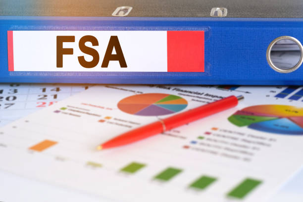 On the table are pie charts, a pen and a folder with the inscription - FSA. On the table are pie charts, a pen and a folder with the inscription - FSA. Flexible spending account. Business and finance concept. free syrian army stock pictures, royalty-free photos & images