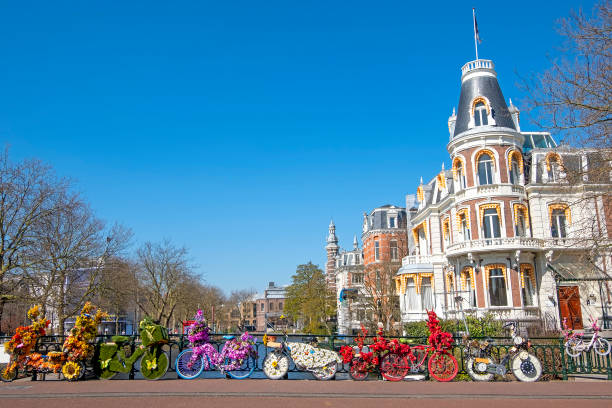 istock Bikes decorated with flowers in Amsterdam the Netherlands in spring 1252616224