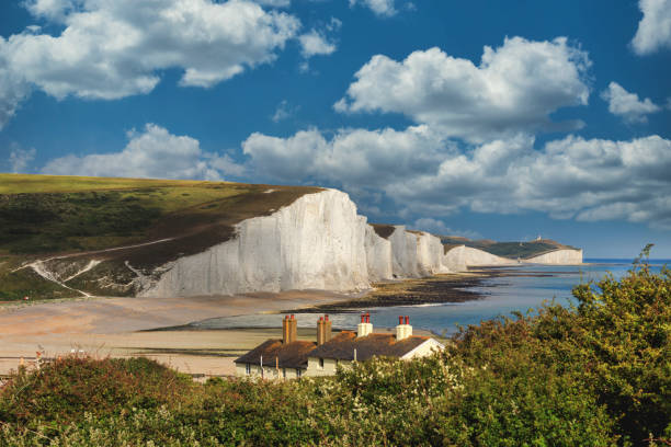 Seven Sisters country park tall white chalk cliffs, East Sussex, UK Seven sisters country park tall white chalk cliffs, East Sussex, UK. panorama of seven sisters cliffs in brighton sussex stock pictures, royalty-free photos & images