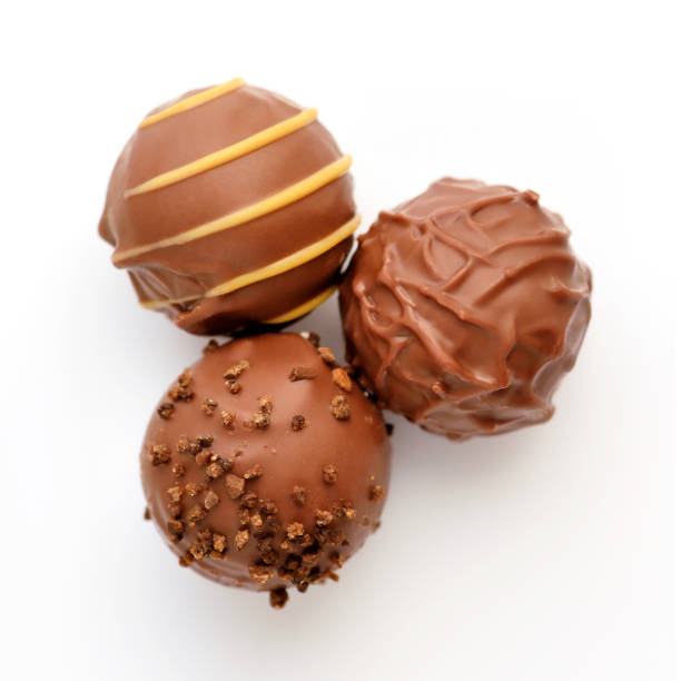 istock Three candies of milk chocolate on white background. Top view. 1252617186